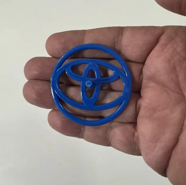 Plastic spinning top from a 3D Toyota car