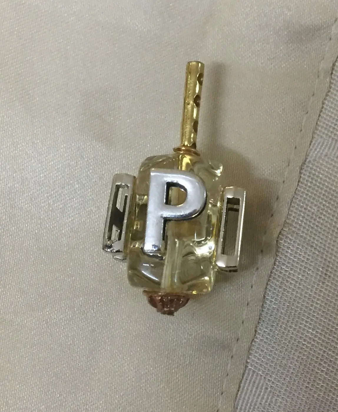 סביבון חרוז עם כיתוב N,G,H,P