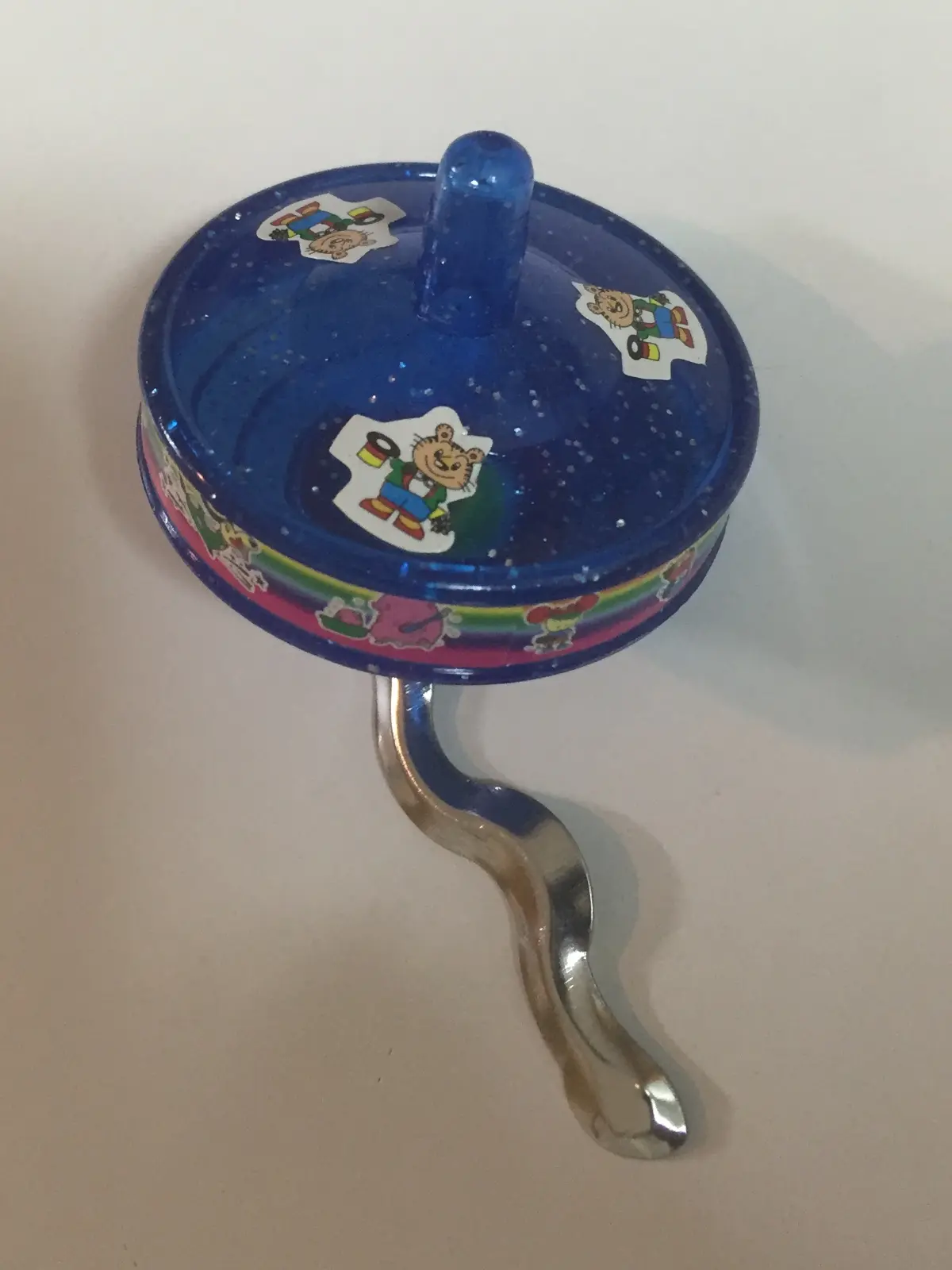 Plastic spinning top from a 3D printer Volkswagen car emblem