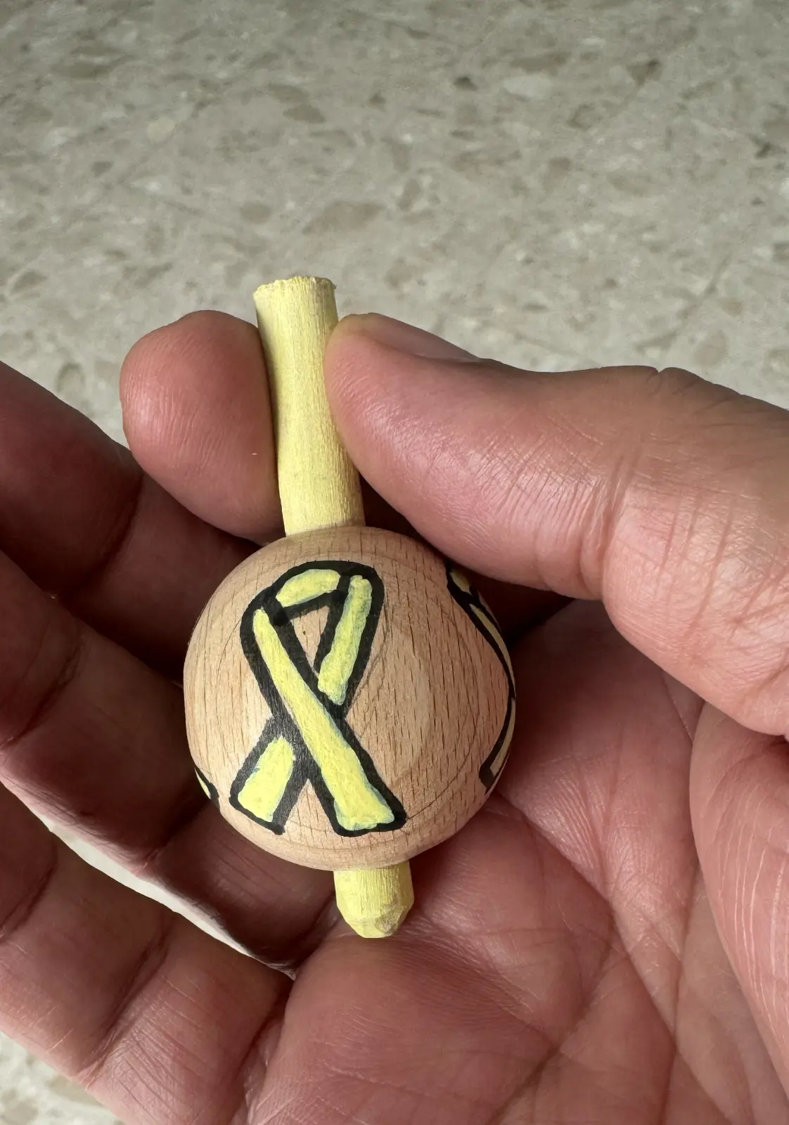 Spinning top with the symbol of the kidnapped